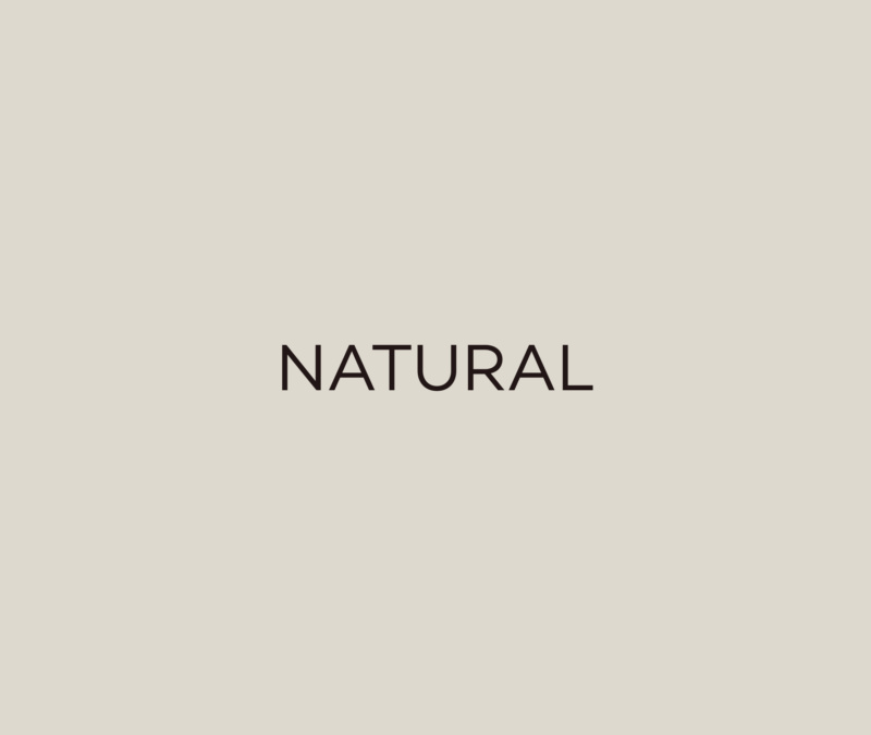 Beige background with the word “NATURAL” in black uppercase text.