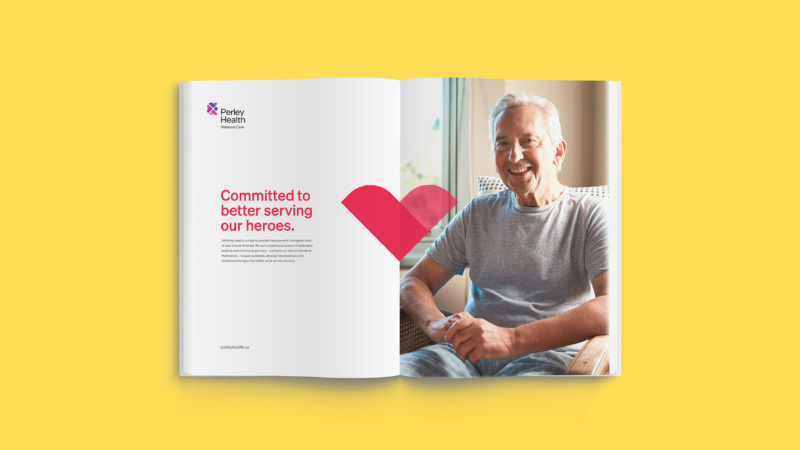 Open magazine with headline “Committed to better serving our heroes” and photo of smiling senior man.