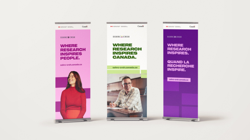 Set of three vertical banners with people and text reading “Where Research Inspires.”
