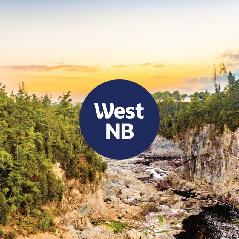 West NB emblem over a sunset valley photo background