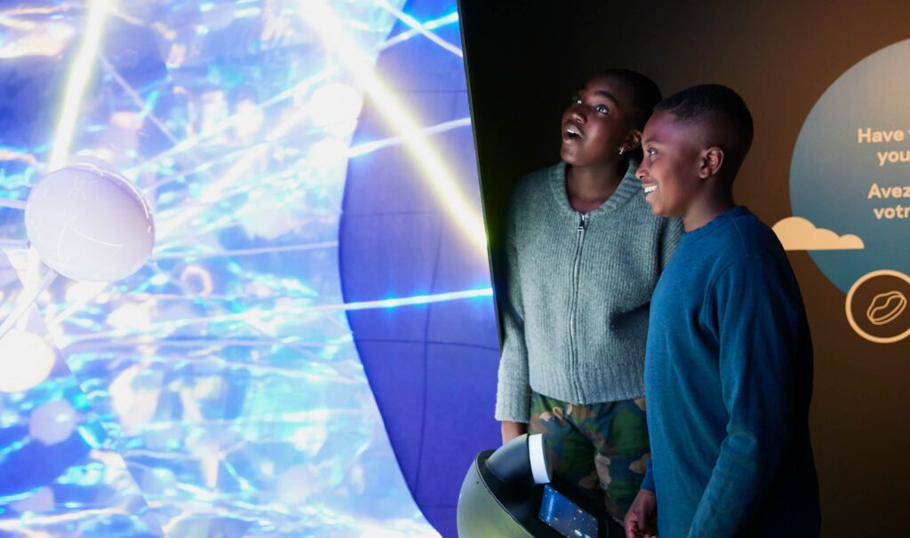 two people looking in wonder at museum artifacts